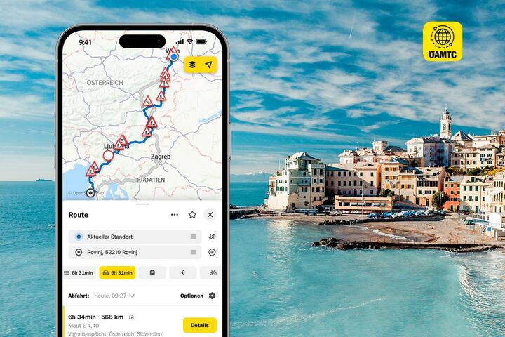 Eine Smartphone-Ansicht zeigt die Funktion "Routenplaner" der ÖAMTC-App mit dem Hintergrundbild von Santorin