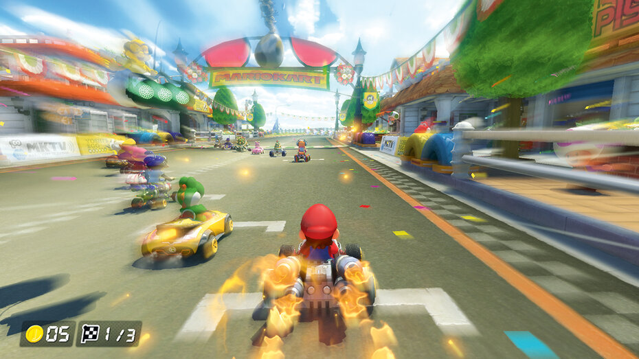 Screenshot aus Mario Kart 8 Deluxe. Der Start eines Rennens, wir sehen Mario im Fokus.