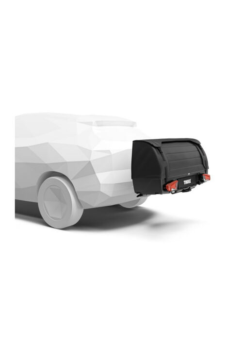 Modell eines Autos an dessen Anhängerkupplung ein Ladungsträger befestigt ist.