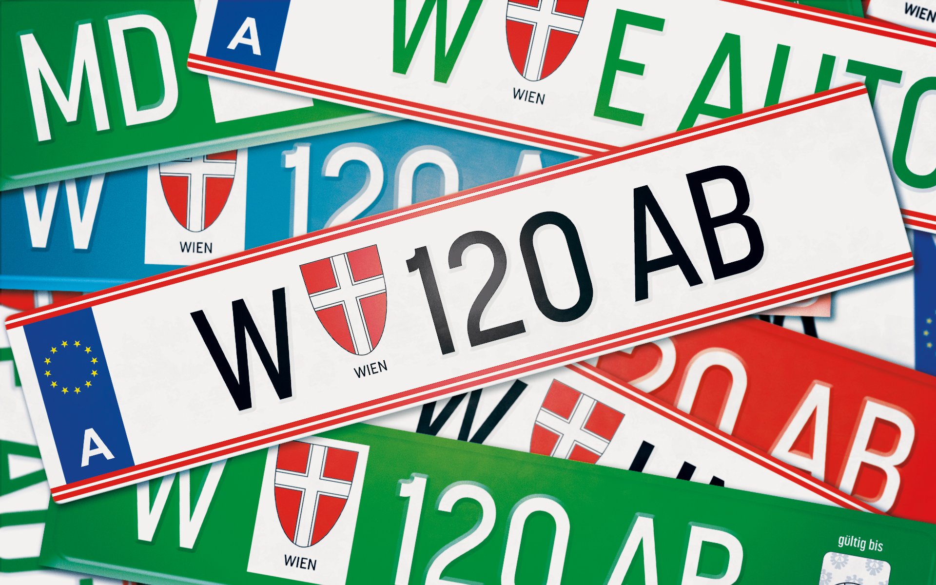 Collage von verschiedenen Wiener Autokennzeichen in weiß, hellblau, grün, rot u.a.