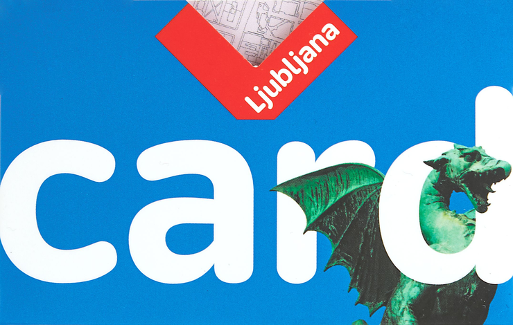 Eine Karte mit blauem Hintergrund zeigt das Wort "card" und den Namen "Ljubljana" in einem roten Dreieck. Ein grüner Drache ist ebenfalls auf der Karte abgebildet.