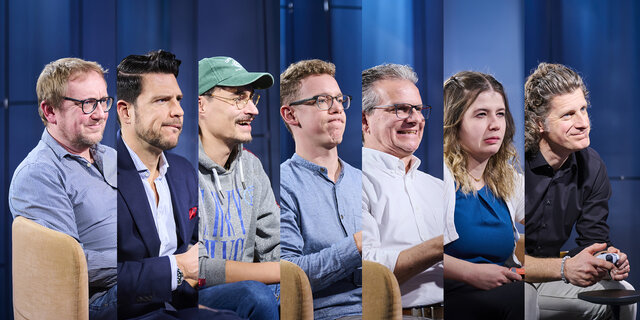 Die Redakteure nebeneinander beim Spielen.