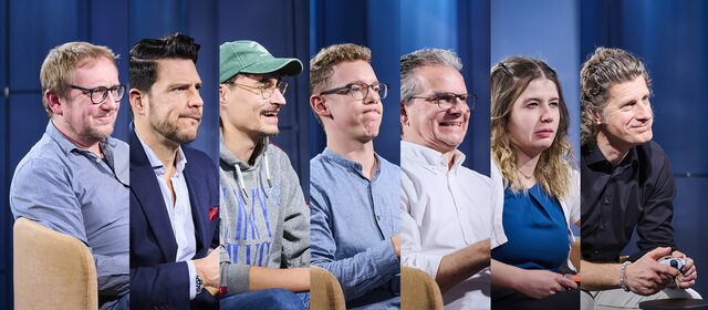 Die Redakteure nebeneinander beim Spielen.