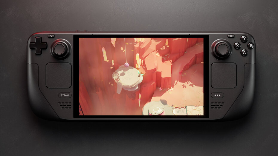 Schwarze Handheldkonsole liegt auf schwarzem Untergrund.