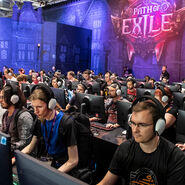 Bild von der gamescom, man sieht Spieler:innen an PCs. Stand: Path of Exile, Halle 6Booth: Path of Exile, Hall 6